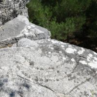 Quarry of Group A. Ancient carving on the rock depicting a ship.