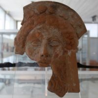 Clay mask representing the god Dionysos.