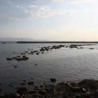 The ancient breakwater and in the background the island of Thassos.