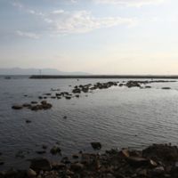 The ancient breakwater and in the background the island of Thassos.